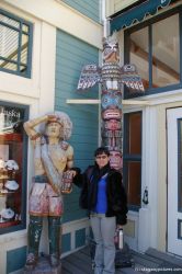 Joann in front of totem pole and Native American statue at Skagway.jpg