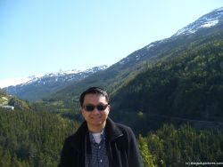 David with Skagway mountains and trees in the background.jpg