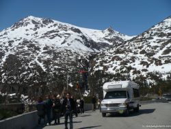 David in front of tour bus and snowy hills in Skagway Alaska.jpg