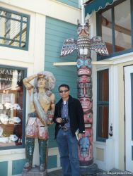 David next to Native American statue and totem pole in Skagway.jpg